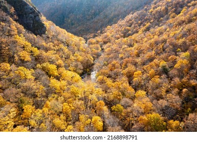 Panoramic view of peak fall foliage in Smugglers Notch, Vermont. - Shutterstock ID 2168898791