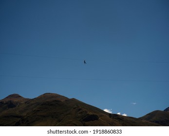 Panoramic View Of Person On Zipline Canopy Flying Fox Cable Ride Adrenaline Adventure Extreme Sports In The Sky Colca Canyon Peru South America