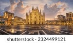 Panoramic view of Piazza del Duomo square with Milan Cathedral, Duomo di Milano, and Galleria Vittorio Emanuele II, Italy, on sunrise. Milan Cathedral is one of the largest churches in the world.
