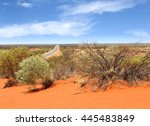 Panoramic view point of lonely empty Lasseter Highway to Uluru Ayers Rock, remote wilderness of Outback Australia.