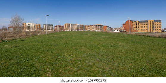 Panoramic view of polygon urban landscape or housing development, with empty lots to build 