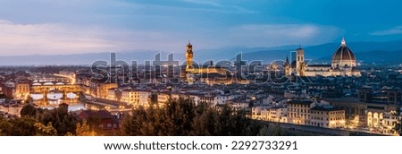 Panoramic view of the Ponte Vecchio, Piazza della Signoria and Cattedrale di Santa Maria del Fiore during blue hour. Florence, Italy.