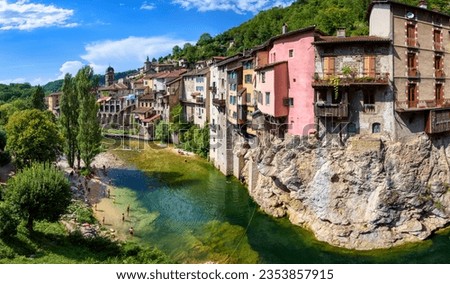 Panoramic view of the Pont-en-Royans picturesque historical town, famous for its hanging houses on the rock landmark and alpine river flowing through the center, Isere, France