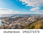 Panoramic view of the port in Barcelona in a sunny day. Cargo Port Terminals Transport and Facilities At The Docks