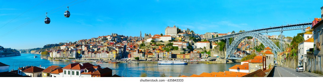 Panoramic view of Porto with cable car and boats on Douro river. Portugal