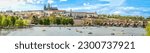 A panoramic view of Prague, the capital of the Czech Republic. View of Prague Castle and Charles Bridge. Summer time, people swim on catamarans. banner