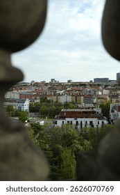 Panoramic view of Prague featuring red rooftops, historic buildings, and the Vltava River. A timeless European cityscape rich with culture, architecture, and charm.