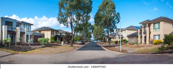 Panoramic View Of
A Quiet Suburban Street Lined With Beautiful Houses And Trees In Melbourne's Residential Suburb. Sanctuary Lakes, VIC Australia.