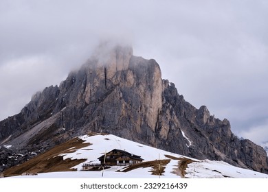 Panoramic view of Ra Gusela peak in front of mount Averau and Nuvolau, in Passo Giau, high alpine pass near Cortina d'Ampezzo, Dolomites, Italy