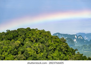 Panoramic view of rainbow over limestone karst mountains from Tiger Cave Temple, Krabi, Thailand