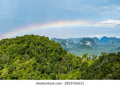 Panoramic view of rainbow over limestone karst mountains from Tiger Cave Temple, Krabi, Thailand