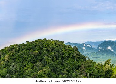 Panoramic view of rainbow over limestone karst mountains from Tiger Cave Temple, Krabi, Thailand