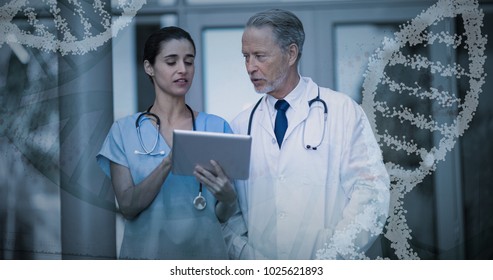 Panoramic view of red dna pattern on screen against doctor and nurse discussing over digital tablet