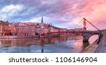 Panoramic view of Saint Georges church and footbridge across Saone river, Old town with Fourviere cathedral at gorgeous sunset in Lyon, France