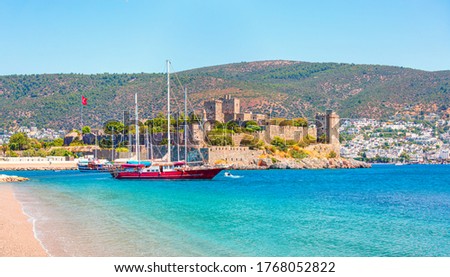 Panoramic view of Saint Peter Castle (Bodrum castle) and marina 
View of Bodrum beach in the foreground - Bodrum, Turkey