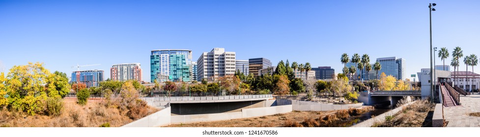 Panoramic View Of San Jose's Downtown Skyline As Seen From The Shoreline Of Guadalupe River On A Sunny Fall Day; Silicon Valley, California