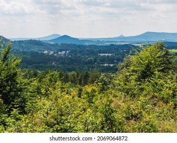 Panoramic view from sandstone rock viewpoint Havrani skaly, spring landscape in Lusatian Mountains , green hills, fresh deciduous and spruce tree forest. Blue sky background, copy space - Shutterstock ID 2069064872