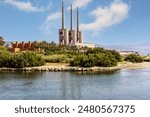 Panoramic View of Sant Adriá Thermal Power Station with its Three Imposing Chimneys under the Blue Sky
