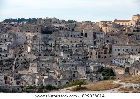 Panoramic view of Sassi di Matera a historic district in the city of Matera, well-known for their ancient cave dwellings from the Belvedere di Murgia Timone,  Basilicata, Italy 