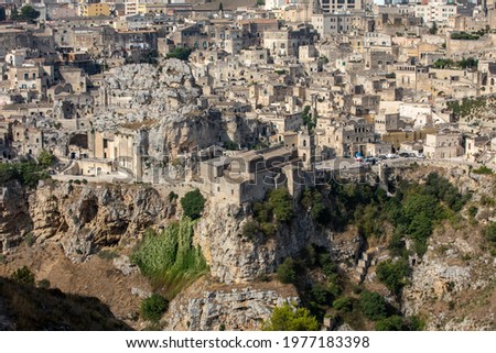 Panoramic view of Sassi di Matera a historic district in the city of Matera, well-known for their ancient cave dwellings from the Belvedere di Murgia Timone,  Basilicata, Italy 