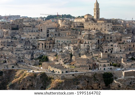 Panoramic view of Sassi di Matera a historic district in the city of Matera, well-known for their ancient cave dwellings from the Belvedere di Murgia Timone,  Basilicata, Italy 