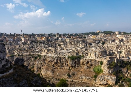 Panoramic view of Sassi di Matera a historic district in the city of Matera, well-known for their ancient cave dwellings from the Belvedere di Murgia Timone,  Basilicata, Italy 