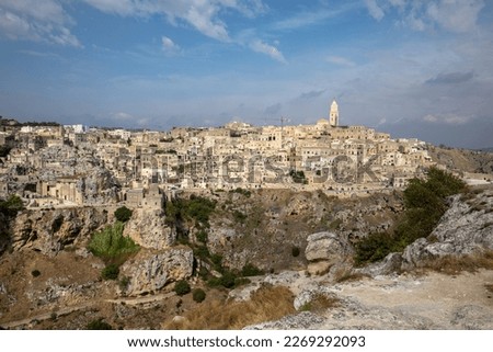 Panoramic view of Sassi di Matera a historic district in the city of Matera, well-known for their ancient cave dwellings from the Belvedere di Murgia Timone,  Basilicata, Italy 
