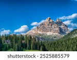 Panoramic view, scenery of Tre Cime di Lavaredo from Lake Misurina, largest natural lake of Cadore, near Auronzo di Cadore, largest natural lake in Cadore region of Italy, blue sky, stunning Dolomite