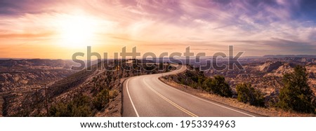 Panoramic View of a scenic route on top of a mountain ridge in the desert. Colorul Sunset Sky Art Render. Taken on Route 12, Utah, United States of America.