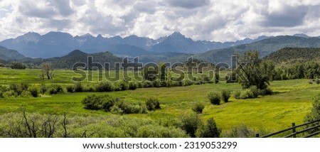 Panoramic view of scenic valley near Continental divide in Colorado with Sanjuan mountains in background.