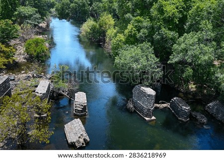 Panoramic view of the serene Bhavani River winding through lush green landscapes in Western Ghats, Tamil Nadu, India. Serene freshwater river photography highlighting South Indian natural beauty