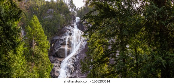 Panoramic View of Shannon Falls during a sunny and cloudy winter day. Squamish, British Columbia, Canada. Nature Background Panorama
