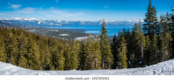 Panoramic view of the Sierra Nevada Mountains of California with Lake Tahoe in the background, from the S. Valley (Palisades) Ski Resort, between Truckee and Tahoe City. - Shutterstock ID 1927291451