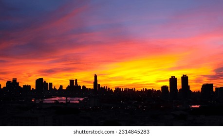 Panoramic view silhouette of the city skyline at sunset and dusk. View of the city's business district The world's most important financial center Asia  - Shutterstock ID 2314845283