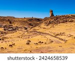 Panoramic view of Sillustani archeological site with its tallest chullpa (funerary tower) and the touristic village in background, Puno region, Peru