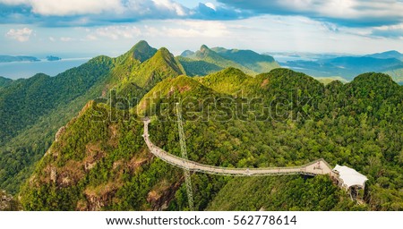 Panoramic view of Sky Bridge and Cable Car with mountains, sea and tropical forests in the background, Langkawi island, Malaysia. Langkawi SkyCab is one of the major attractions in the island.