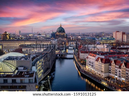 Panoramic view of the skyline of Berlin, Germany, with the famous Berliner Dome, river Spree and the Nicolai district during sunset time
