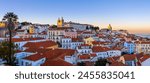 Panoramic view of skyline of Lisbon city, Portugal, many colorful houses  in the Alfama district during twilight.