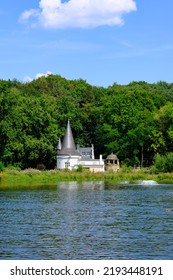 Panoramic View Of A Small Castle With A Lake