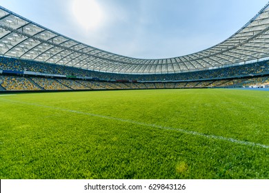 Panoramic view of soccer field stadium and stadium seats 