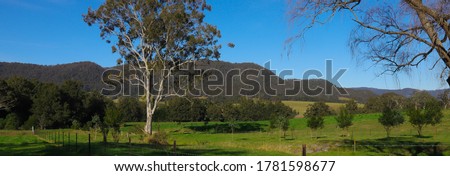 Panoramic view of the southern highlands Kangaroo Valley lush green pastures blue skies