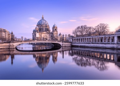 panoramic view at the spree river and the cathedral of berlin during sunset