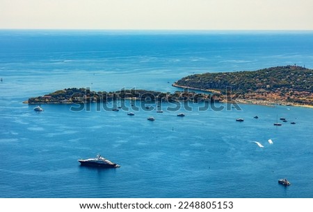 Panoramic view of St. Jean Cap Ferrat cape and Beaulieu sur Mer village seen from historic town of Eze over Azure Cost of Mediterranean Sea in France