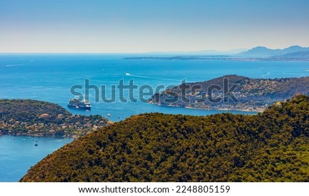 Panoramic view of St. Jean Cap Ferrat cape and Beaulieu sur Mer village seen from historic town of Eze over Azure Cost of Mediterranean Sea in France