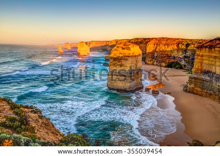 Panoramic view of the stacks that comprise the Twelve Apostles at sunset, one of the main attractions of the Port Campbell National Park. Great Ocean Road, Victoria State, Australia.