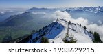 Panoramic view from Stanserhorn in Central Switzerland, with the snowy Stanserhorn mountain ridge. Northern Lake Lucerne and Mt Rigi can be seen in the distance.