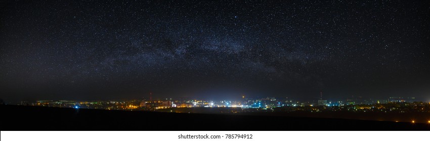 Panoramic View Of The Starry Night Sky Above The City.