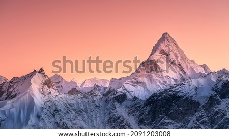 Panoramic view to summit Ama Dablam and snow peaks with beautiful light after sunset in Nepal