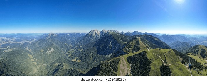 Panoramic View from the Summit Overlooking Alpine Mountain Ranges and Valleys