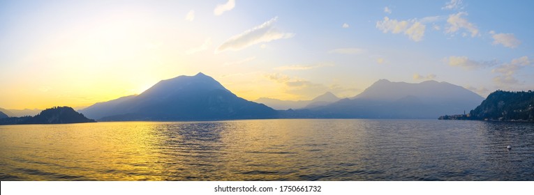 Panoramic view of sunset behind Alps mountains and Como lake, Italy.